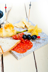 Image showing mix cold cut on a stone with fresh pears