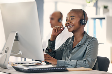 Image showing Customer service, woman call center agent with headset and computer at her desk of a modern workplace office. Telemarketing or online communication, consultant and African female person for support