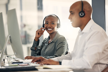 Image showing Customer service, smile and a woman with a headset at computer for call center sales. African female and man or team in crm, telemarketing or help desk support and contact us solution or advice