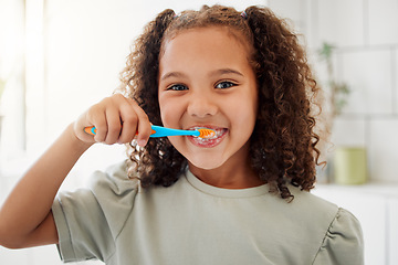 Image showing Toothbrush, brushing teeth and portrait of a child in a home bathroom for dental health and wellness with smile. Face of Latino girl kid learning to clean her mouth for morning routine and oral care