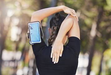 Image showing Fitness, runner or woman stretching arms ready for workout, exercise or workout or body movement. Phone, back view of athlete or healthy girl in running warm up for flexibility or mobility in park