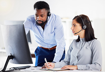 Image showing Collaboration, mentor helping with colleague and headset with computer at her desk of modern office. Teamwork or support, partnership or communication and black man with intern at her workspace