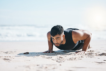 Image showing Man, beach and pushup on sand for exercise, fitness or workout for performance in summer sunshine. Young guy, bodybuilder and training for health, wellness and strong body with self care on ground