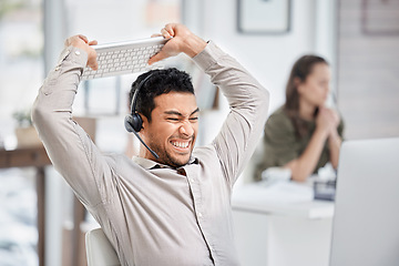 Image showing Call center, smash or angry man in customer service frustrated by consulting or tired of stress. Burnout, anger or upset Asian sales agent talking or smashing a keyboard at tech support in office