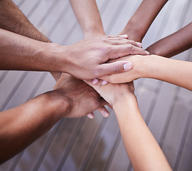 Image showing Teamwork, hands and diversity of people in support, agreement and circle of trust for motivation. Closeup, community and helping hand of group, equality and celebration of success, mission or synergy