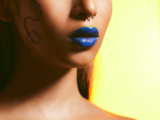 Image showing Makeup, blue lipstick and lips of woman in studio for cosmetics, eye shadow and beauty salon. Creative aesthetic, cosmetology and face zoom of female person for glamour, luxury style and skin glow