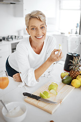 Image showing Portrait, fruit salad and apple with an old woman in the kitchen of her home for health, diet or nutrition. Smile, food and cooking with a happy mature female pensioner eating healthy in the house