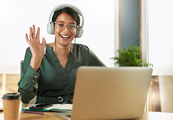 Image showing Virtual meeting, business woman and happy wave on a video call with headphones and greeting. Laptop, working and female employee with company webinar and computer with digital communication at office