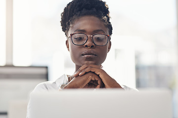 Image showing Thinking, decision and business woman on computer for solution, research and serious, focus or job planning. Reading, review and choice of african person or analyst on laptop for data problem solving