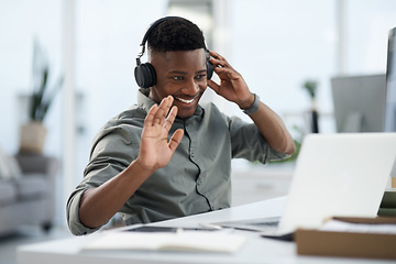 Image showing Happy black man, laptop and video call with headphones for webinar, virtual meeting or introduction at the office. Friendly African male person, consultant or agent smiling with headset for seminar