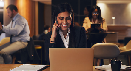 Image showing Happy phone call, laptop and professional woman speaking, talk or negotiation with business investment contact. Coworking lounge, night consultant and person consulting, planning or chat on cellphone