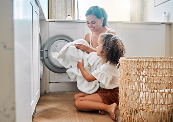 Image showing Help, laundry and washing machine with mother and daughter for cleaning, learning and cleaner. Housekeeping, teamwork and basket with woman and young girl in family home for teaching and clothes