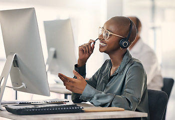 Image showing Call center, talking and a happy woman with headset at computer for customer service or crm. Black person support agent at pc for account information, promotion or sale for telemarketing or help desk