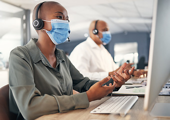 Image showing Call center, face mask and a woman at computer with headset for safety compliance or health. African female agent talk at pc for customer service, help desk or crm with covid or bacteria protection