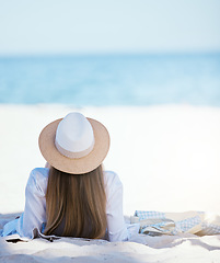 Image showing Woman, back and relax at beach with space, mockup and sky background on summer vacation in sunshine. Girl, lying and waves with travel, holiday and calm in sun, sea mockup and sand in Rio de Janeiro