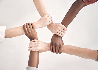 Image showing Teamwork, hands of people together with support for strategy and planning with collaboration at start up. Trust in team, coworking and diversity, hand to wrist circle with employees in cooperation.