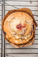 Image showing Muffins with red fruits jam fill.