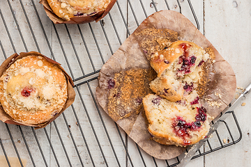 Image showing Muffins with red fruits jam fill.