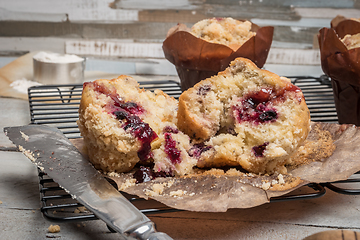 Image showing Muffins with red fruits jam fill.