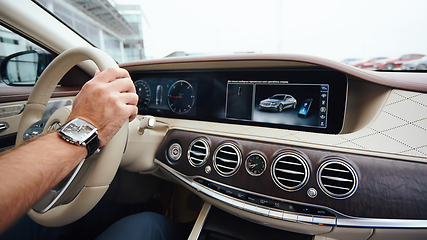 Image showing Man sitting and driving in the car.