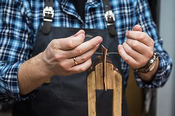 Image showing Concept of handmade craft production of leather goods.