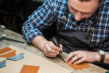 Image showing Concept of handmade craft production of leather goods.