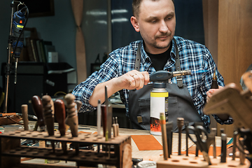 Image showing Concept of handmade craft production of leather goods.