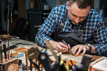 Image showing Concept of handmade craft production of leather goods.