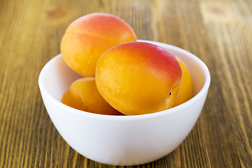 Image showing apricots in a plate