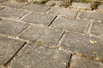 Image showing old large tiles on the road