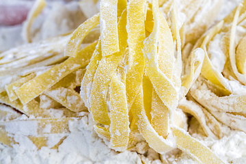 Image showing raw pasta with flour