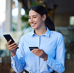 Image showing Credit card, phone and business woman in city for online shopping, financial payment and banking or loan. Professional person typing on mobile, digital transaction or bank, fintech and e commerce