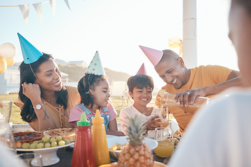 Image showing Birthday, parents and kids with food in park for event, celebration and party outdoors together. Family, social gathering and mother, father with children at picnic with juice, presents and cake