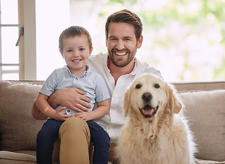 Image showing Father, home portrait and dog with child in living room for love, happiness and quality time. Animal, pet and dad with young kid, golden retriever and smile to relax on a sofa in a lounge together