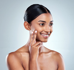 Image showing Happy, beauty and woman or model with skincare cosmetic isolated in a studio white background with glow skin. Clean, natural and young female person hand on her face and smile for self love or care