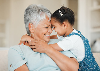 Image showing Family, girl and grandmother with forehead touch, happiness and bonding with smile and affection at home. Love, care and trust with elderly woman and young child happy with hug in living room