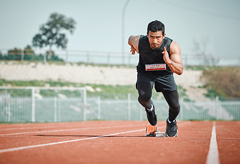 Image showing Stadium focus, man running and athlete on a runner and arena track for sprint race training. Fast, run and sports exercise of a male person in marathon for fitness and cardio workout outdoor