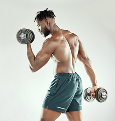 Image showing Exercise, strong and black man with dumbbells, workout goal and healthy guy on a white studio background. Male person, model or bodybuilder with gym equipment, strength and power with muscle and body