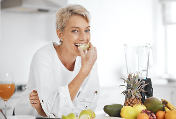 Image showing Portrait, fruit salad and apple with an elderly woman in the kitchen of her home for health, diet or nutrition. Smile, food and cooking with a happy senior female pensioner eating healthy in a house