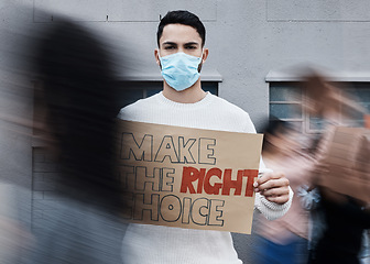 Image showing Protest signage, man face mask and portrait with fight, human rights and rally sign in city. Urban, group and protesting people with a male person holding a pro vaccine movement poster on a street