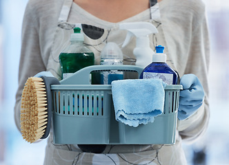 Image showing Hands, basket and product for cleaning home with brush, cloth or chemical for hygiene by blurred background. House, professional cleaner woman or plastic container for services, stop bacteria or dust