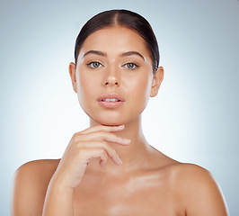 Image showing Face, skincare and beauty of woman in studio isolated on a white background. Portrait, natural and serious female model in makeup, cosmetics or facial treatment for skin health, aesthetic or wellness