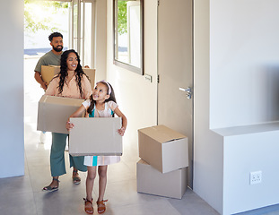 Image showing Happy family, real estate and moving in new home with box for property, mortgage loan or relocation. Mother, father and child homeowner carrying boxes together for renovation in apartment or house