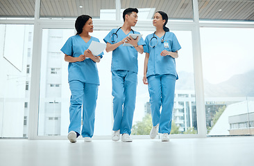 Image showing Teamwork, discussion or medical students walking or planning a surgery strategy in collaboration. Internship, doctors or young surgeons with tablet talking, working or speaking of hospital healthcare