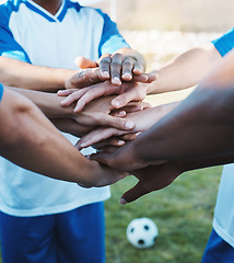 Image showing Hands stacked, sports and men on a soccer field for support, motivation and team spirit. Goal, training and athlete football players with a gesture for celebration, solidarity and trust at a game