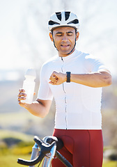 Image showing Cycling, bike and man with a smart watch, fitness and exercise with workout goal, training, and water bottle. Male person, biker or athlete outside, checking time and monitor progress with online app