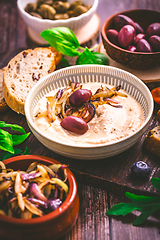 Image showing Whipped feta cheese dip with garlic, olives, lemon and caramelized onions. 