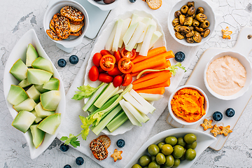 Image showing Crudites platter, raw vegetarian food or party vegetarian platter with various veggie snacks and dips