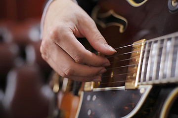 Image showing Guitar picking