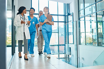 Image showing Healthcare, doctors and nurses walking together for discussion, planning or schedule. Diversity, men or women medical group talking about support strategy, medicine and surgery teamwork in hospital